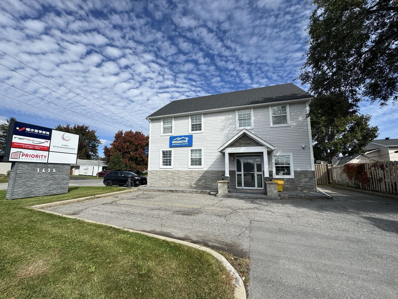 Street view of ALX Massage & Bodywork at 1415 Woodroffe Avenue, Ottawa — look for the 1415 sign